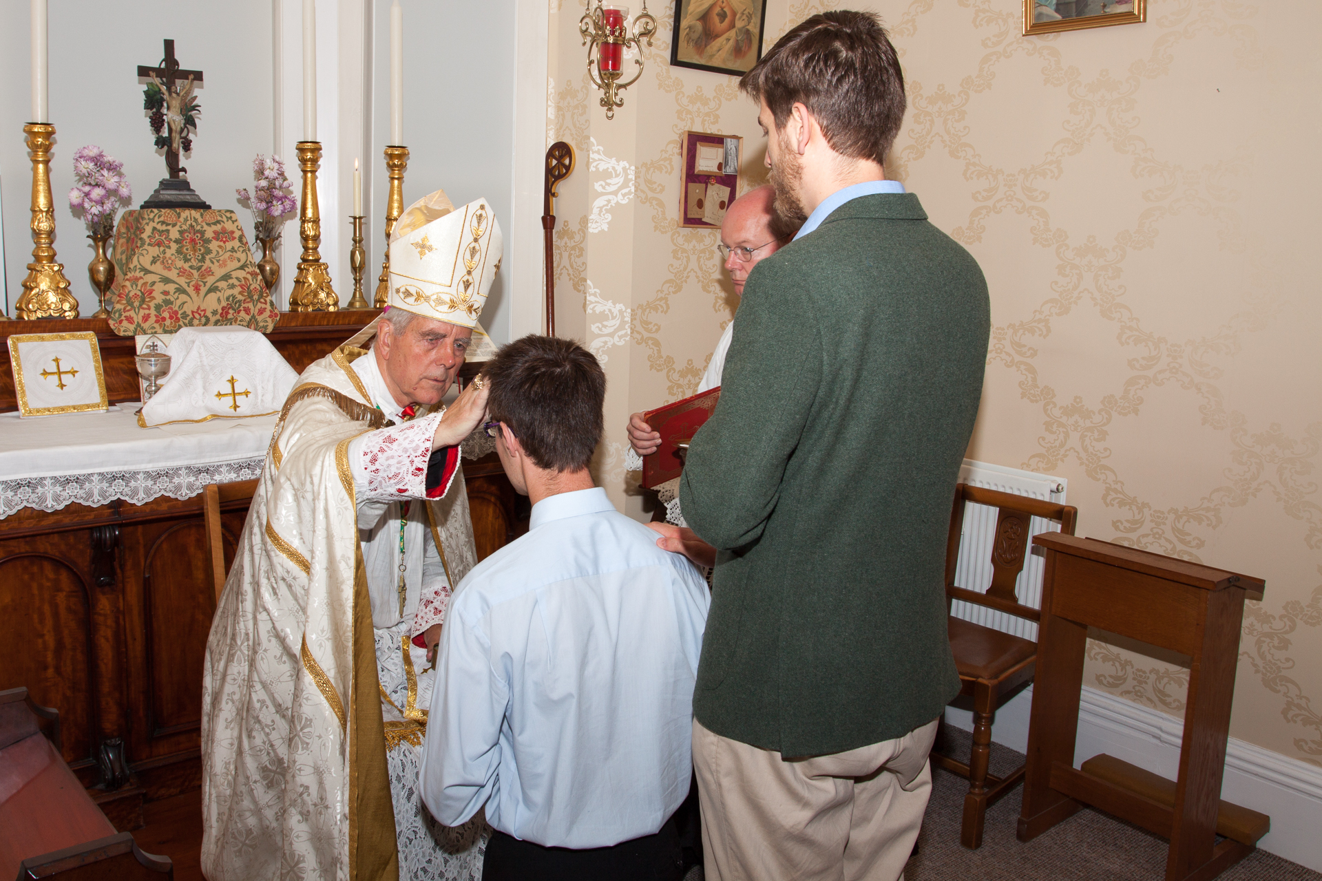 The Confirmation ceremony of one of the pilgrims before Mass on 31st August. 