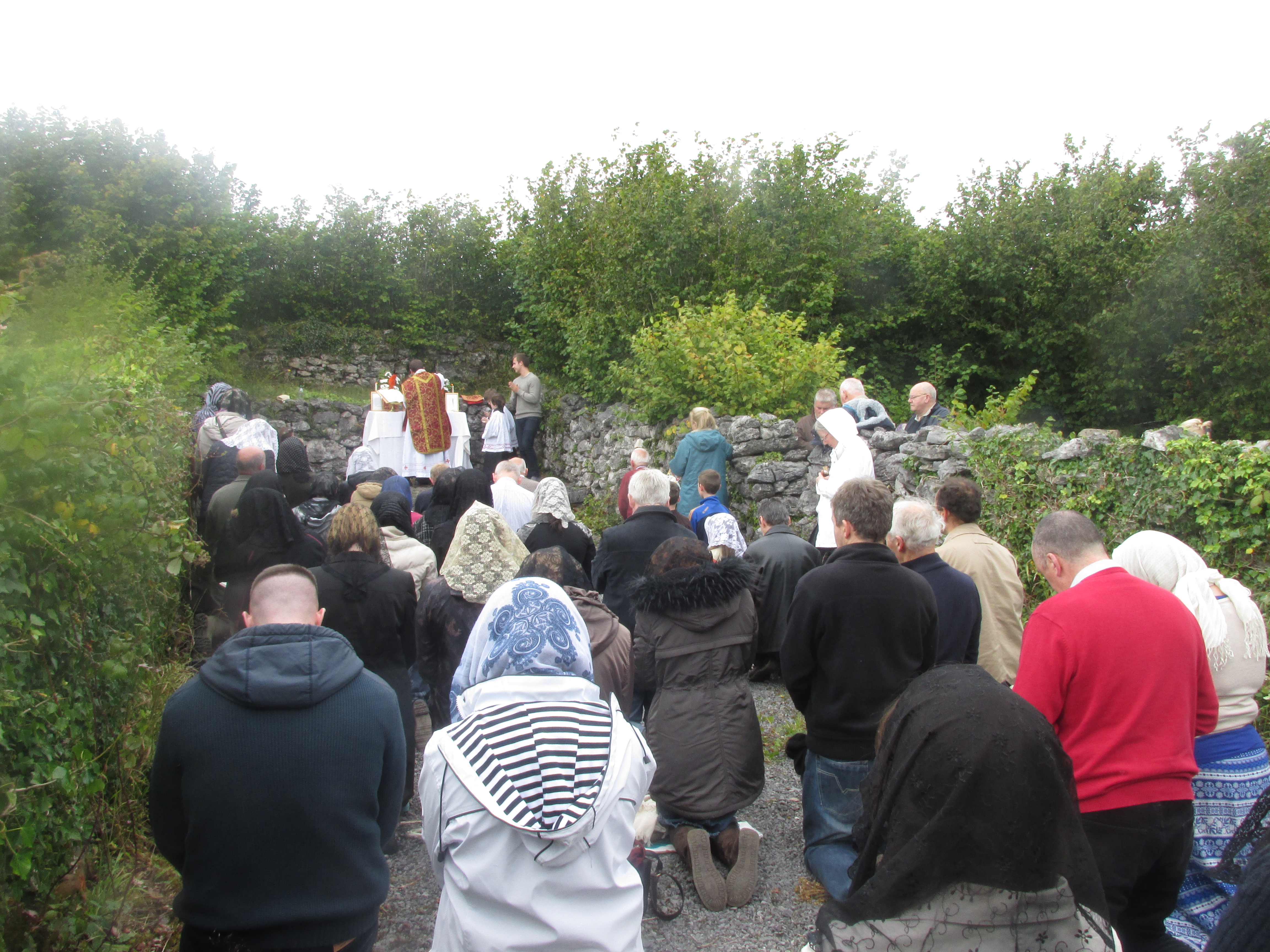 Fr Ballini saying Mass at the Mass Rock.