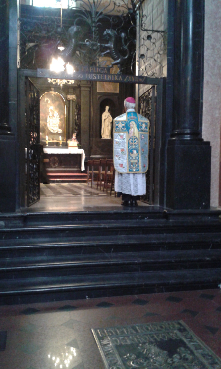 The Bishop standing in the chapel of the Shrine of Jasna Gora and before offering the Mass.
